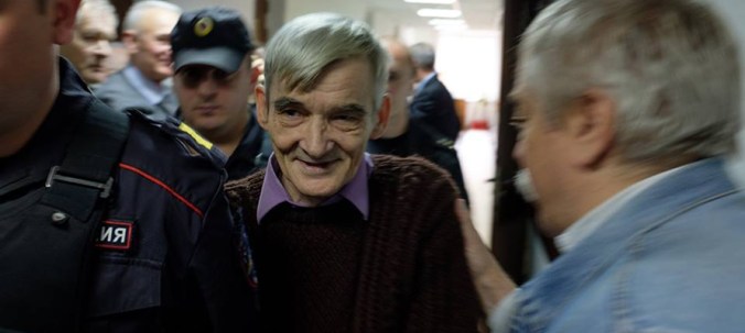 Dmitriev greeted by Razumov in court corridor